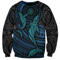Black unisex sweatshirt with teal and cyan whale graphic and circular emblem on front