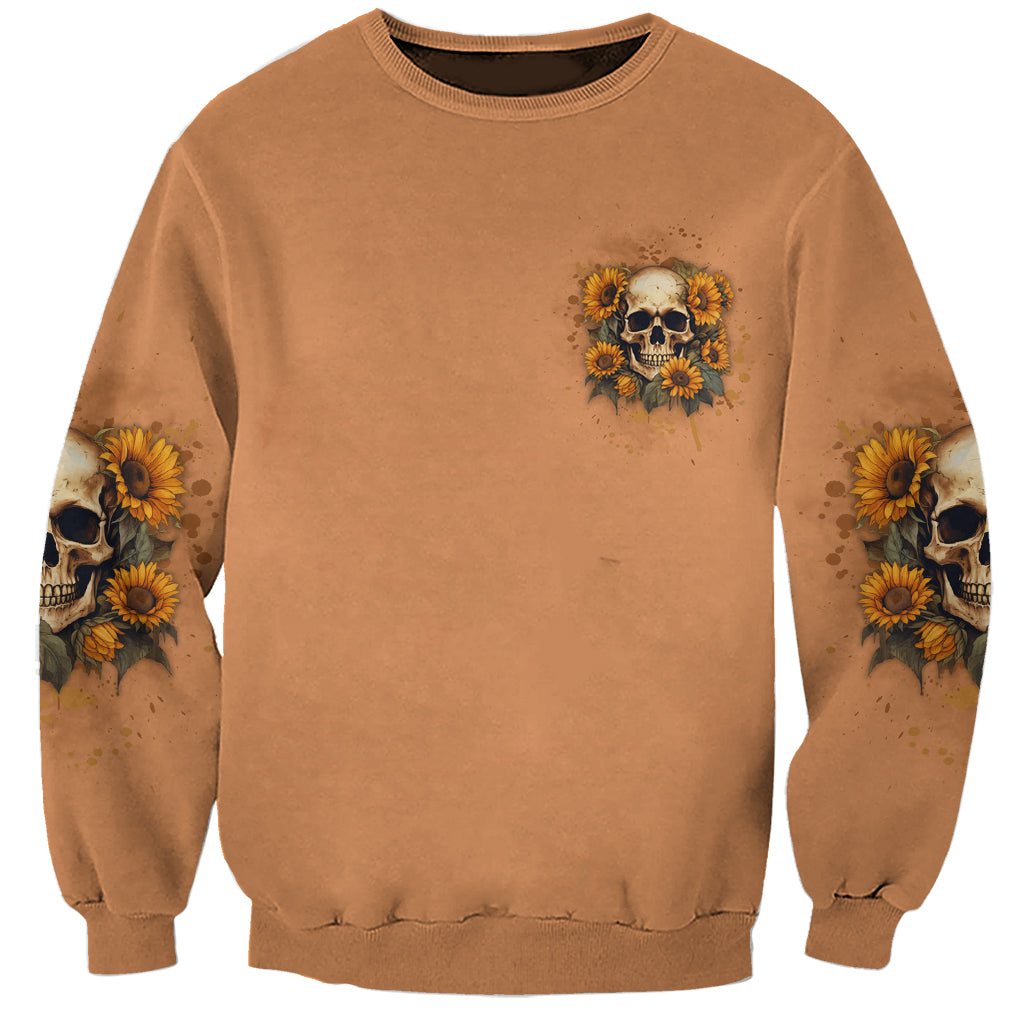Brown sweatshirt with small sunflower skull chest graphic, long sleeves