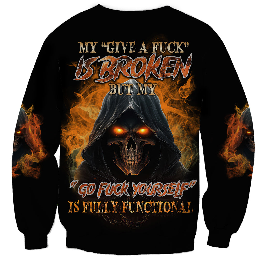 Black sweatshirt with hooded skull graphic, flames, and “Broken” text