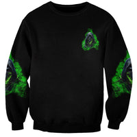 Black unisex sweatshirt with small green demon emblem on chest and ghostly sleeve prints