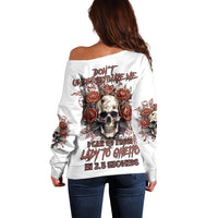 White off-shoulder sweater with full back graphic of skull and roses, long sleeves
