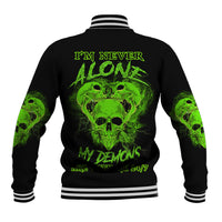 Black baseball jacket with green skull demon graphic on back and striped ribbed collar