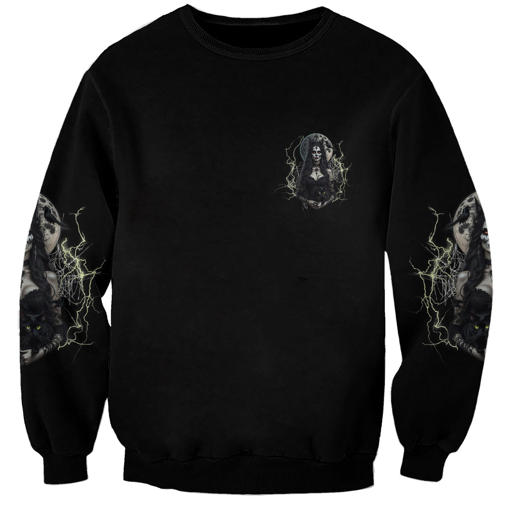 Unisex black sweatshirt with small witch graphic on chest and lightning sleeve prints