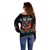 Women’s off-shoulder black sweater with large multicolor skull graphic and flame accents