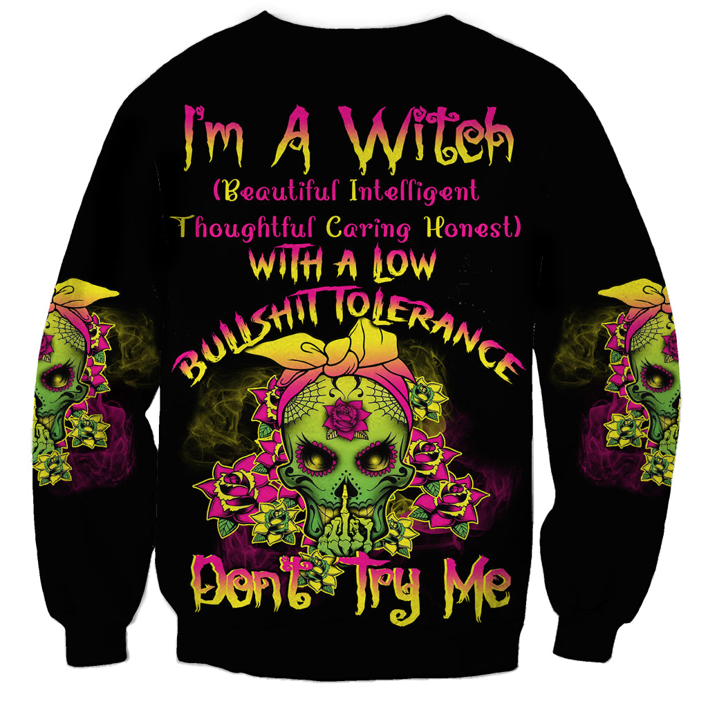 Black sweatshirt with colorful skull graphic and bold front text