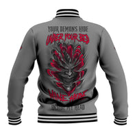 Dark gray baseball jacket, striped cuffs, large red skull graphic on back