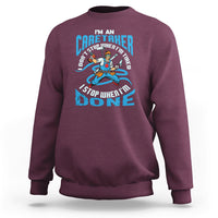 Maroon sweatshirt with caregiver motivational graphic on the chest