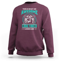 Maroon sweatshirt with teal "Awesome Caretaker" graphic and "Looks Like" text
