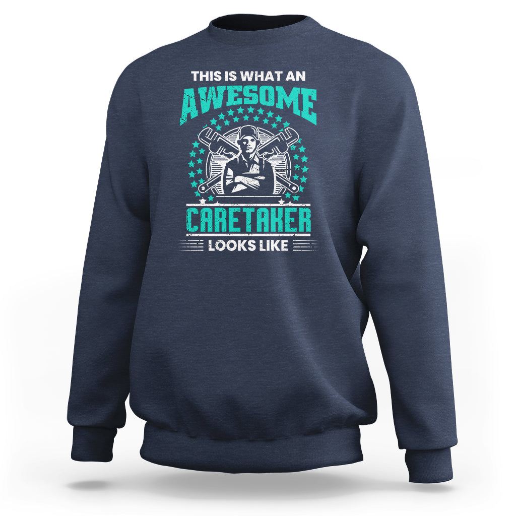 Navy sweatshirt with teal "Awesome Caretaker" graphic and "Looks Like" text