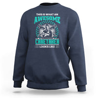 Navy sweatshirt with teal "Awesome Caretaker" graphic and "Looks Like" text
