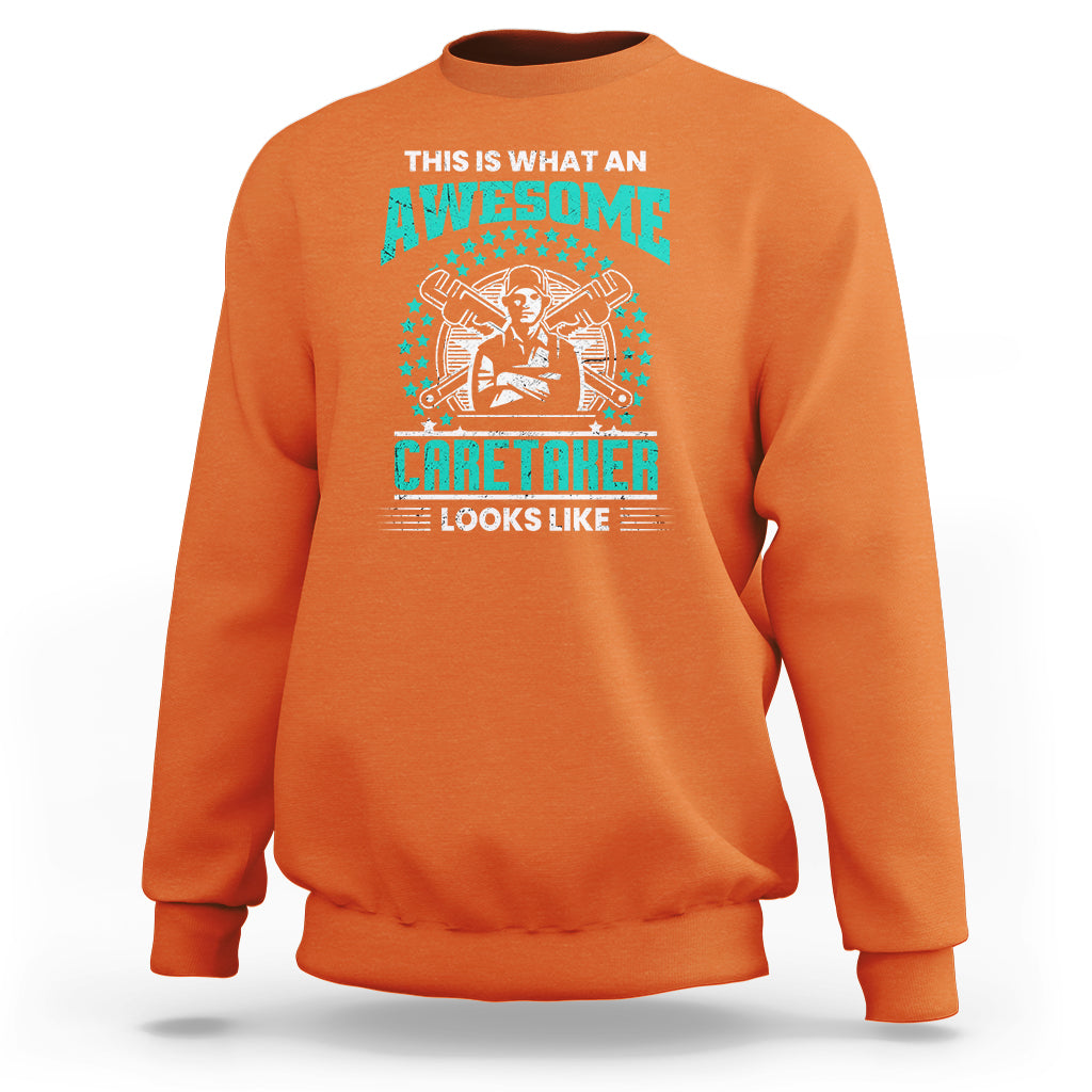 Orange sweatshirt with teal "Awesome Caretaker" graphic and "Looks Like" text