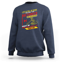 Navy crewneck sweatshirt with colorful 'Auctioneer' graphic on the front