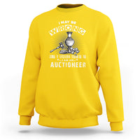 Daisy yellow crewneck sweatshirt with front auctioneer emblem graphic and lettering.