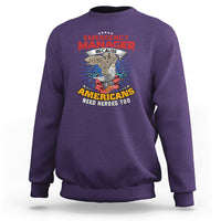 Purple sweatshirt with Emergency Manager eagle graphic and “Americans need heroes too”