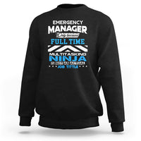 Black crewneck sweatshirt with large "Emergency Manager" "Ninja" text graphic on front