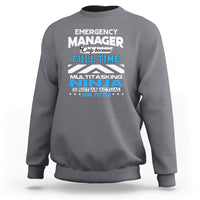 Charcoal gray crewneck sweatshirt with "Emergency Manager" "Ninja" text graphic