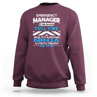 Maroon crewneck sweatshirt with "Emergency Manager" "Ninja" text graphic on the front