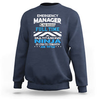 Navy crewneck sweatshirt with "Emergency Manager" "Ninja" text graphic on the front