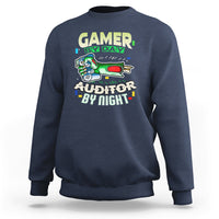 Navy crewneck sweatshirt with “GAMER BY DAY” and “AUDITOR BY NIGHT” chest graphic.