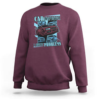 Maroon crewneck sweatshirt with colorful car inspector graphic and slogan on chest