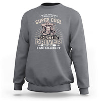 Charcoal gray crewneck sweatshirt with front “Shutter Driver” graphic print.