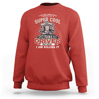 Red crewneck sweatshirt with front “Shutter Driver” graphic print.