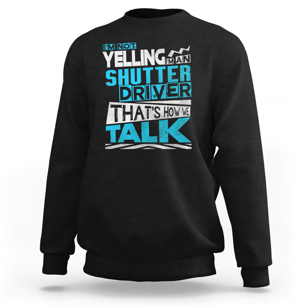 Black crewneck sweatshirt with colorful 'Shutter Driver' 'That's how we talk' print