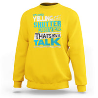 Daisy yellow crewneck sweatshirt with colorful 'Shutter Driver' 'That's how we talk' print