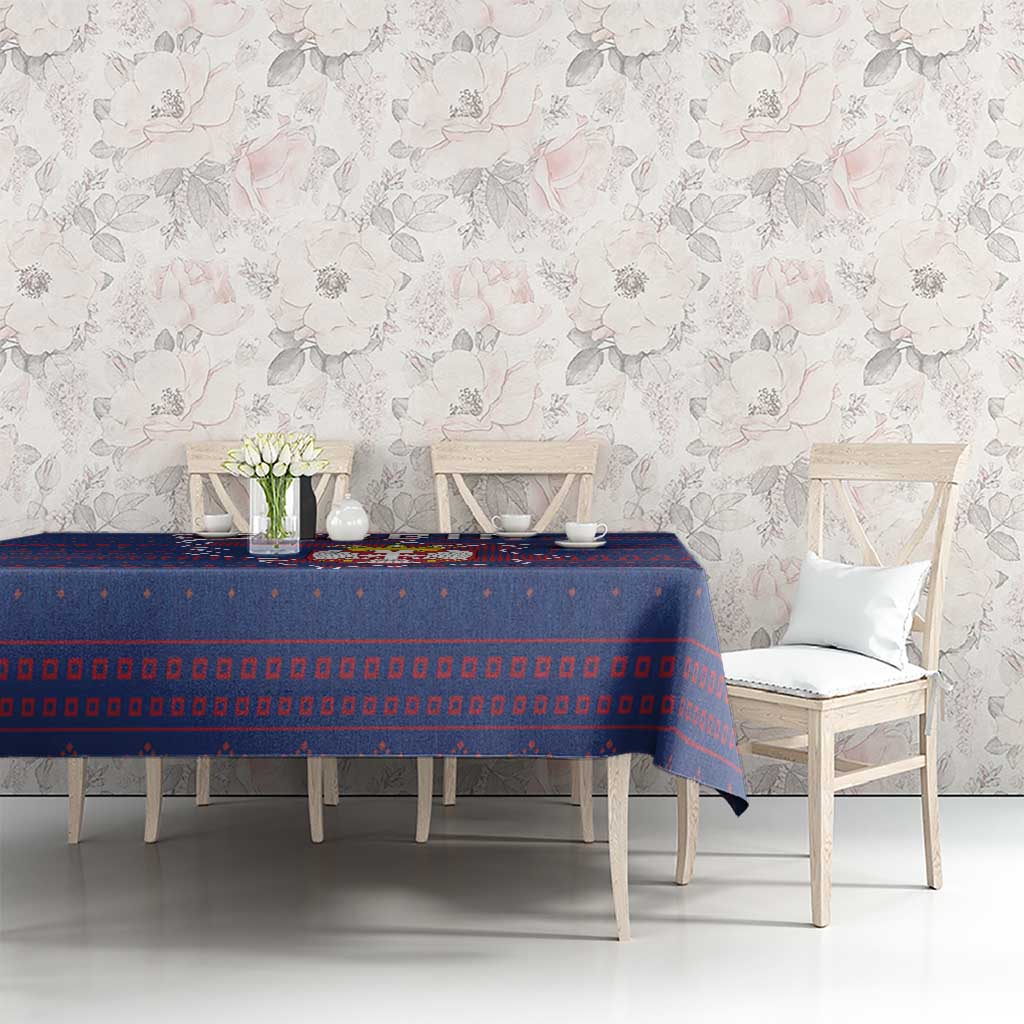 Blue Serbia-themed tablecloth with red map and crest motif across table surface