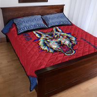 Red quilt bed set with blue patterned shams and colorful wolf face graphic
