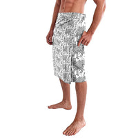 Knee-length wrap skirt with black-and-white mythic figure motif print, side view