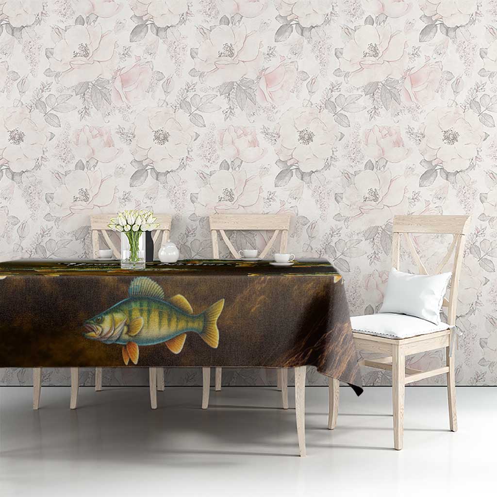 Walleye fish tablecloth with dark gradient and yellow-scale print, set on dining table.