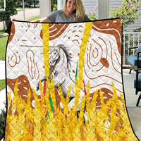 Multicolor quilt with white background, yellow bottom, brown swirls, and gray horse center