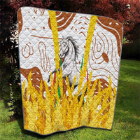 Multicolor quilt showing gray horse artwork, brown swirl motifs, and textured yellow quilted bottom