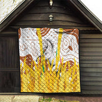 Multicolor quilt hanging in doorway with gray horse artwork, brown swirls, and yellow diamond quilting