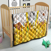 Multicolor quilt on baby bed with gray horse graphic, brown swirls, and yellow textured lower half
