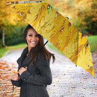 Abstract umbrella canopy with animal portrait, yellow foliage, white accents