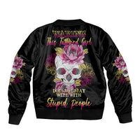 Black bomber jacket with ribbed collar, back skull-flower graphic, and sleeve floral patches