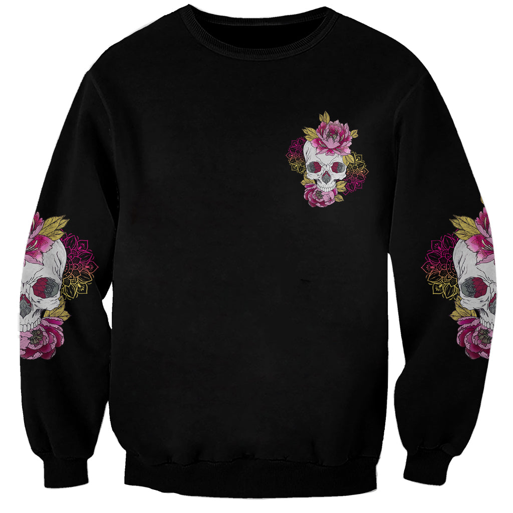 Unisex black sweatshirt with small skull-and-flowers print and multicolor sleeve accents