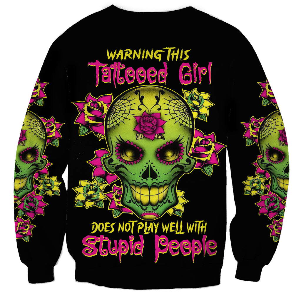 Black unisex sweatshirt with multicolor sugar skull flower tattoo graphic and lettering