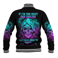 Black baseball jacket with teal and purple skull graphic on back, striped ribbed trim