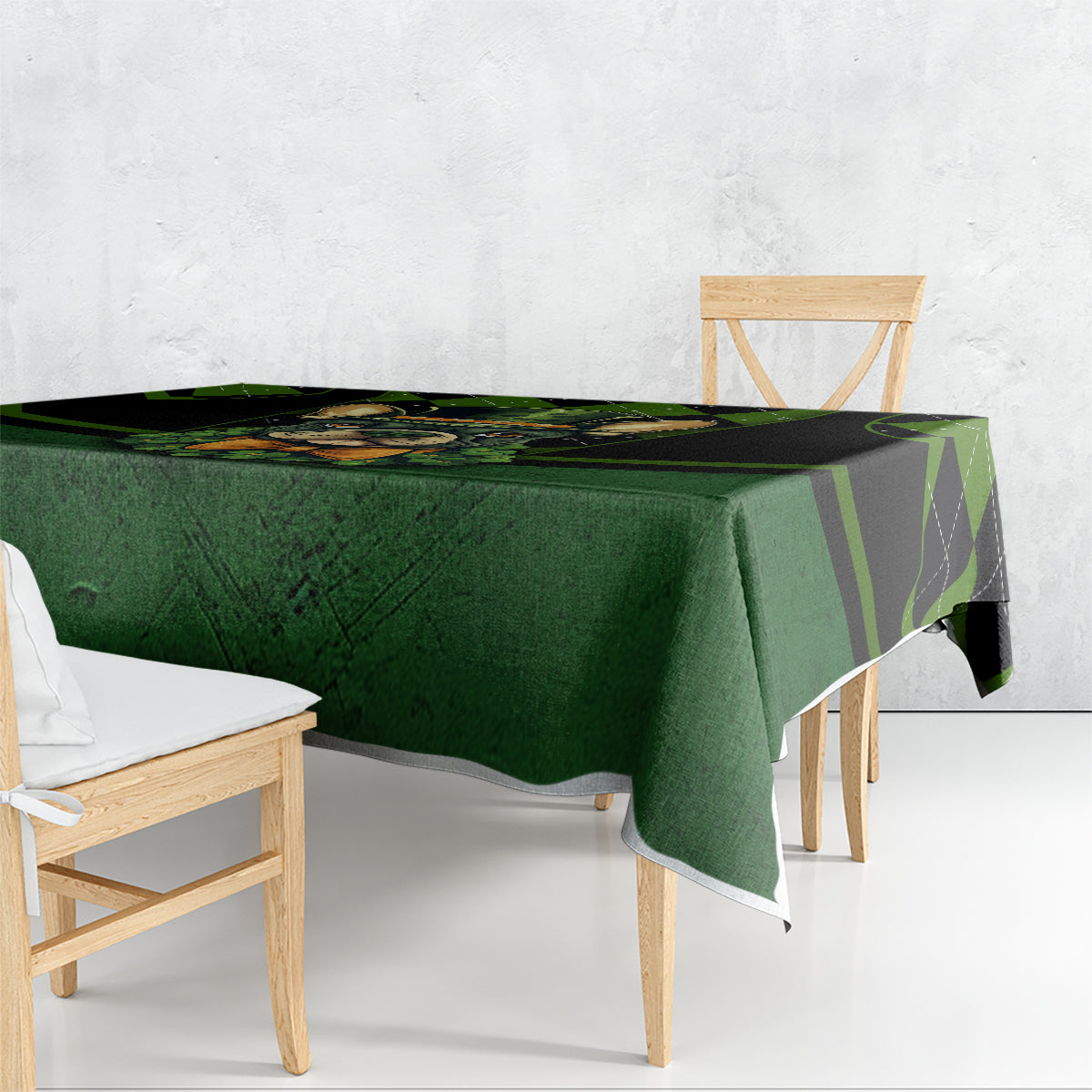 Green tablecloth with black check stripe design and rabbit graphic, draped on table