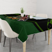 Green tablecloth with black plaid bands and centered rabbit graphic on dining table