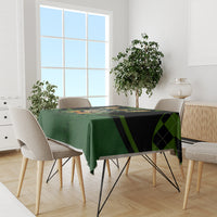 Green tablecloth with black plaid stripe accents and rabbit design on dining table