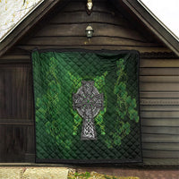 Dark green outdoor quilt with Celtic cross centerpiece and shamrock floral clover print
