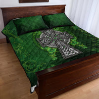 Green quilt bed set with quilted shamrock panels, celtic cross motif, and two shams