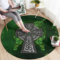 Round green rug with Celtic cross center and shamrock border pattern
