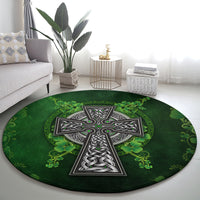 Round green rug with centered gray Celtic cross and clover leaf ornaments