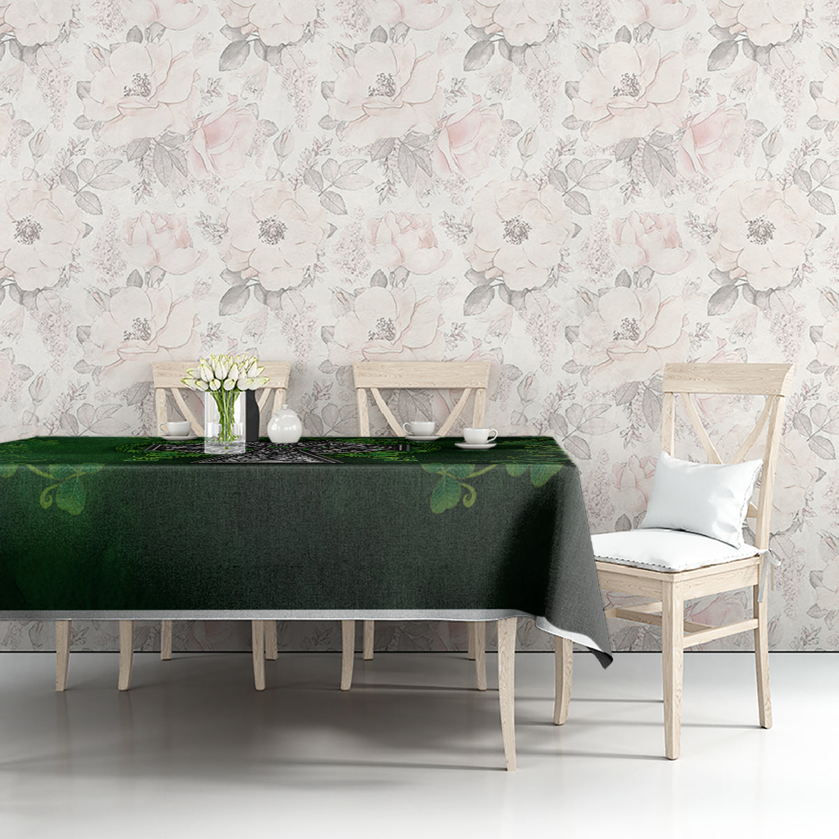 Green tablecloth with Irish cross and shamrock floral pattern on dining table.