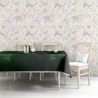 Green tablecloth with Irish cross and shamrock floral pattern on dining table.